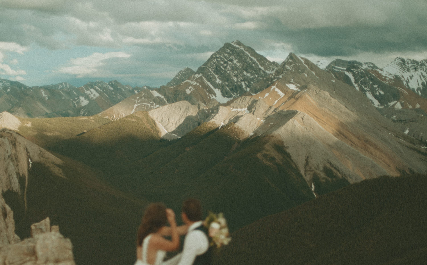 Couple staring off into the mountains